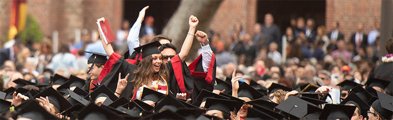 Graduates with hands in the air